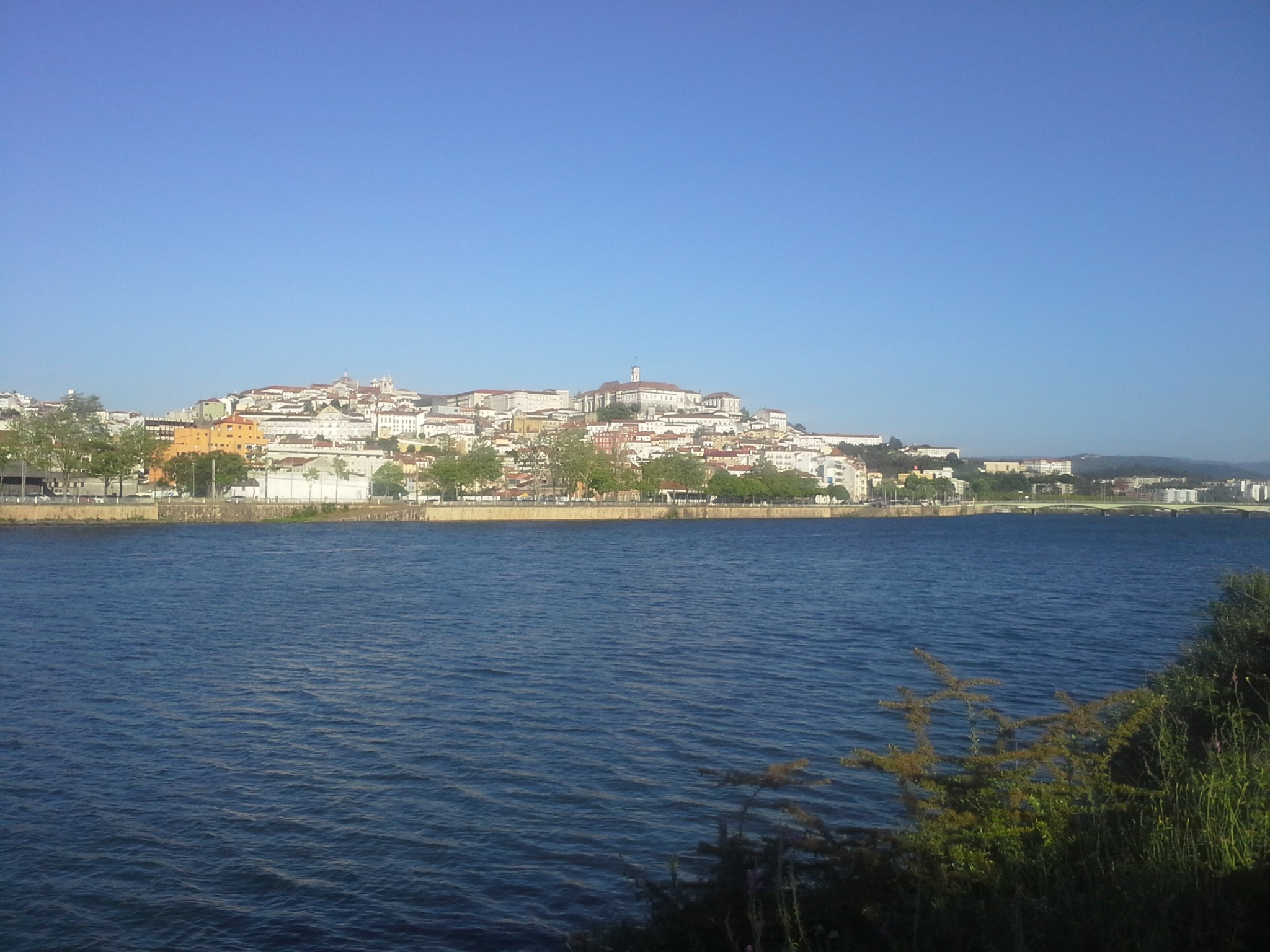 The River Mondego with Coimbra’s historic skyline on the opposite bank